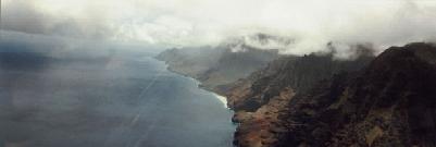 Clouds and rain move in over the cliffs.